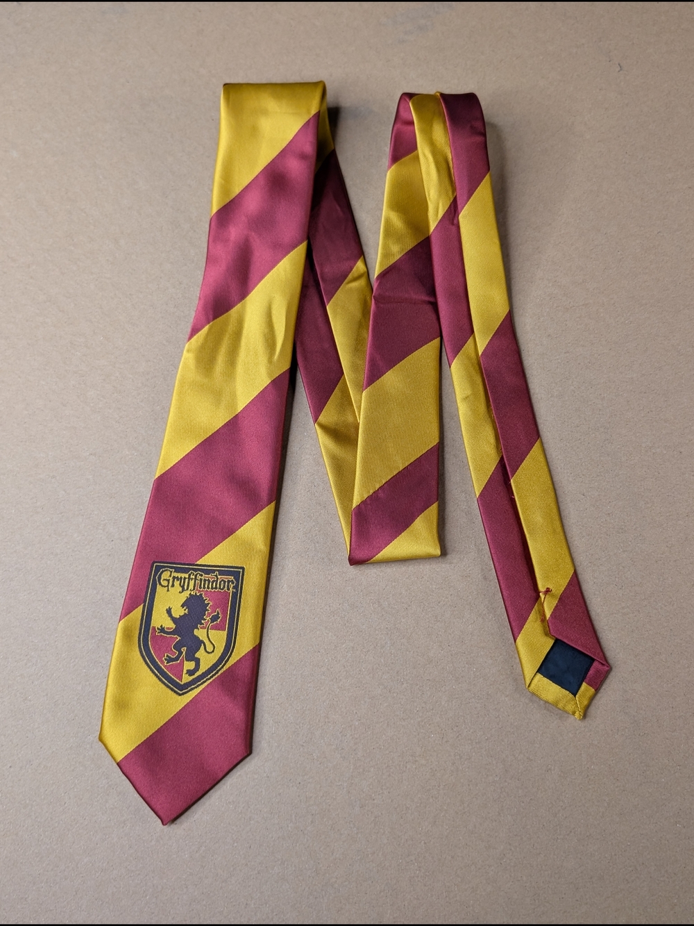 Griffindor Maroon and Gold Diagonal Stripe Tie with Crest
